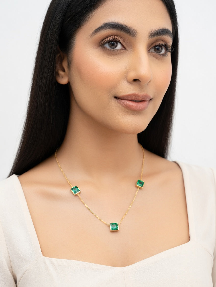 Silver plated emerald necklace by Ashir Studio featuring three connected emerald pendants on a delicate chain.