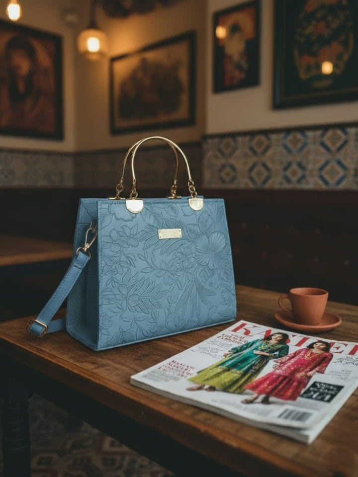 Ashir Studio floral embossed luxury tote collection jewelry with intricate floral patterns and elegant design.