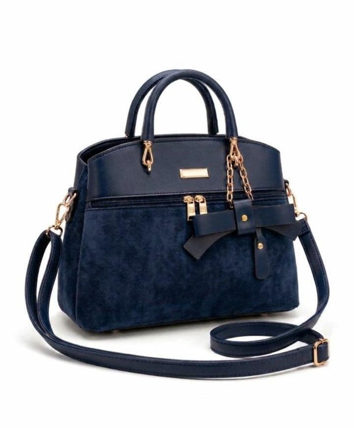 Mixed-media bow accent satchel jewelry piece by Ashir Studio featuring a stylish bow design and mixed materials.