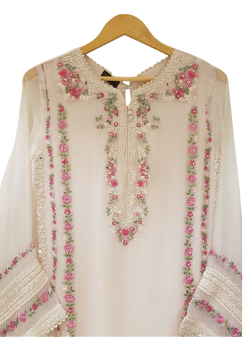 Handmade beige chiffon kurta from Ashir Studio showcasing elegant fabric and traditional design on a plain background.