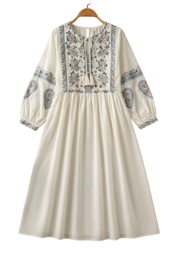 Handmade white boho dress from Ashir Studio, featuring flowing fabric and bohemian style, displayed on a hanger.