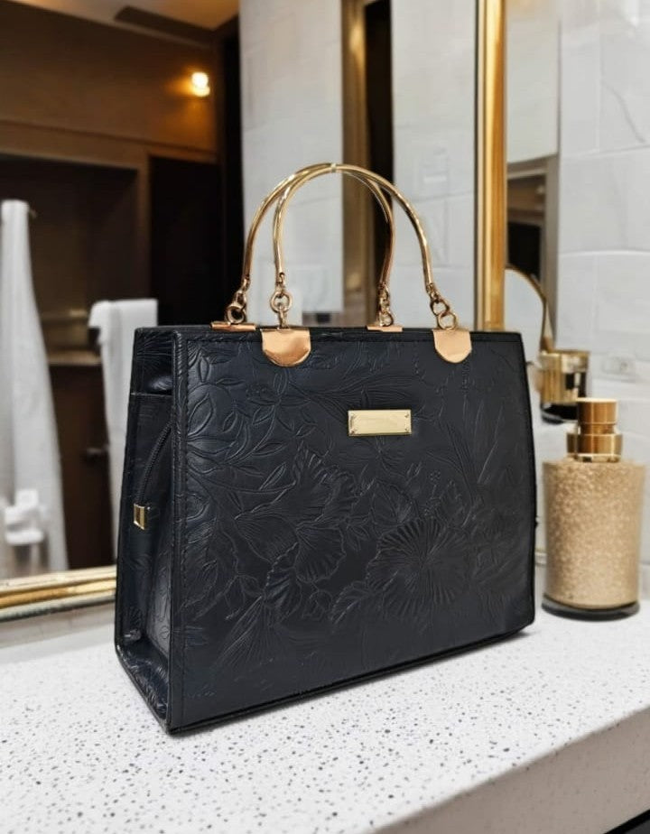 Ashir Studio floral embossed luxury tote jewelry collection with intricate floral patterns and embossed details on a stylish tote.