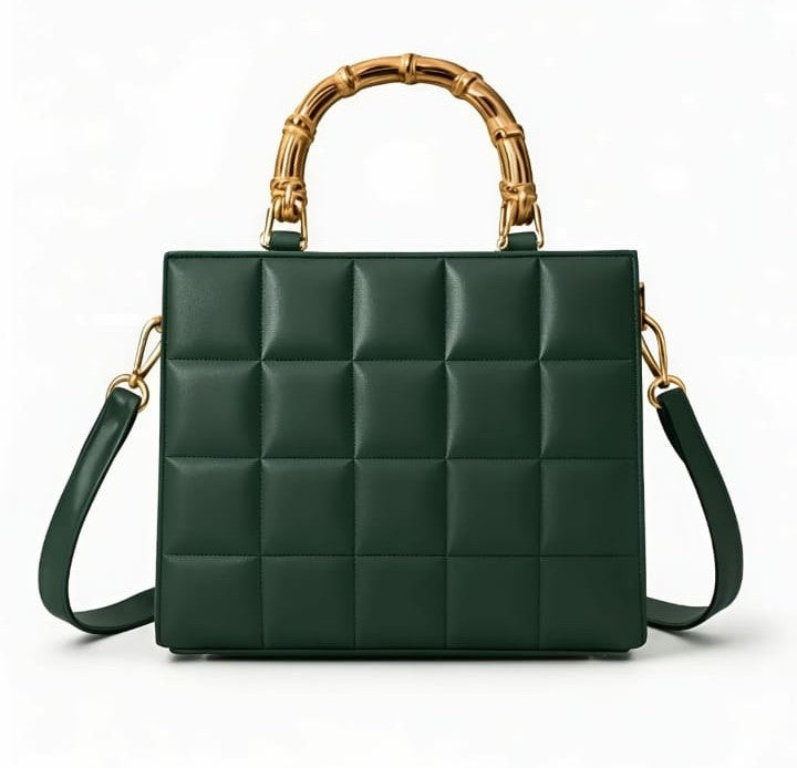Emerald quilted handbag with bamboo handle by Ashir Studio, showcasing elegant design and textured quilting.