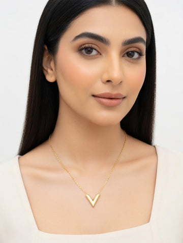 Elegant V-shaped necklace by Ashir Studio featuring intricate jewelry craftsmanship on a delicate chain.