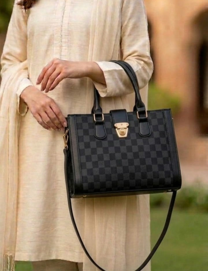 Heritage checkered satchel jewelry pouch from Ashir Studio with a stylish design and secure clasp, ideal for organizing jewelry.