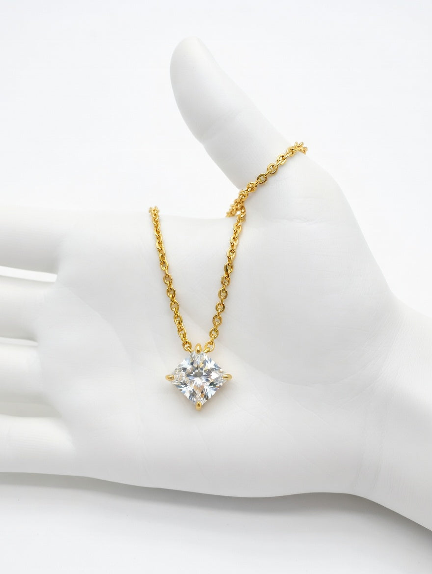 Elegant diamond-shaped square-cut solitaire necklace by Ashir Studio showcasing a sparkling central gemstone and sleek jewelry design.