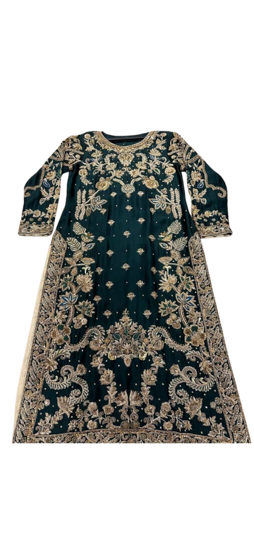 Handmade emerald green silk kurta from Ashir Studio, showcasing intricate fabric and elegant traditional design.