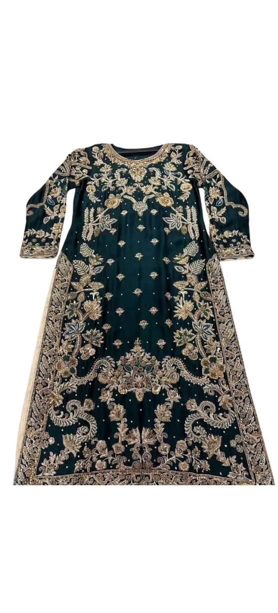 Handmade emerald green silk kurta from Ashir Studio, showcasing intricate fabric and elegant traditional design.