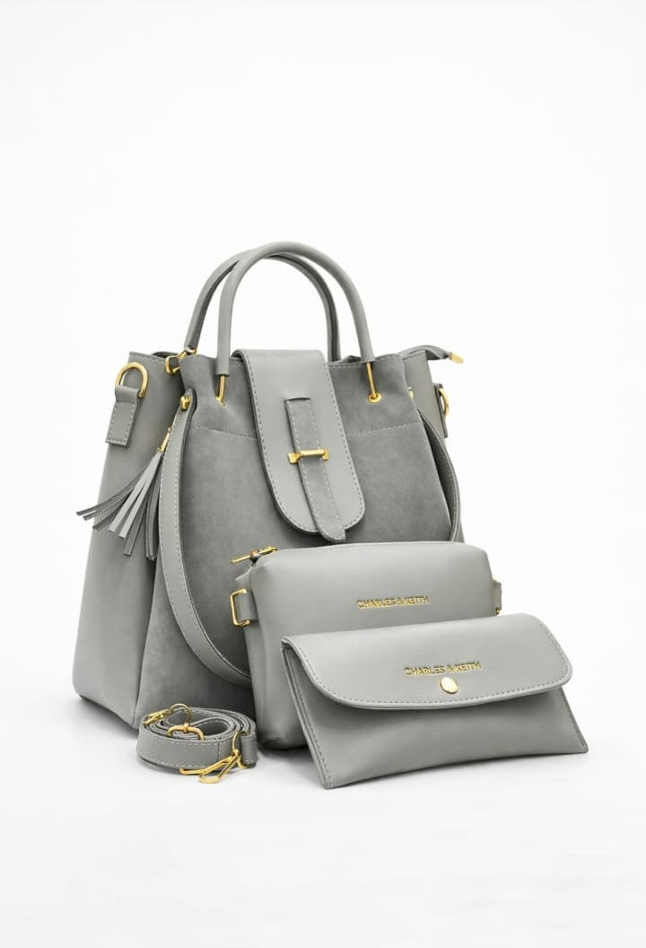 Ashir Studio Noir Luxe 3-piece jewelry collection featuring suede and leather accessories arranged on a neutral background.