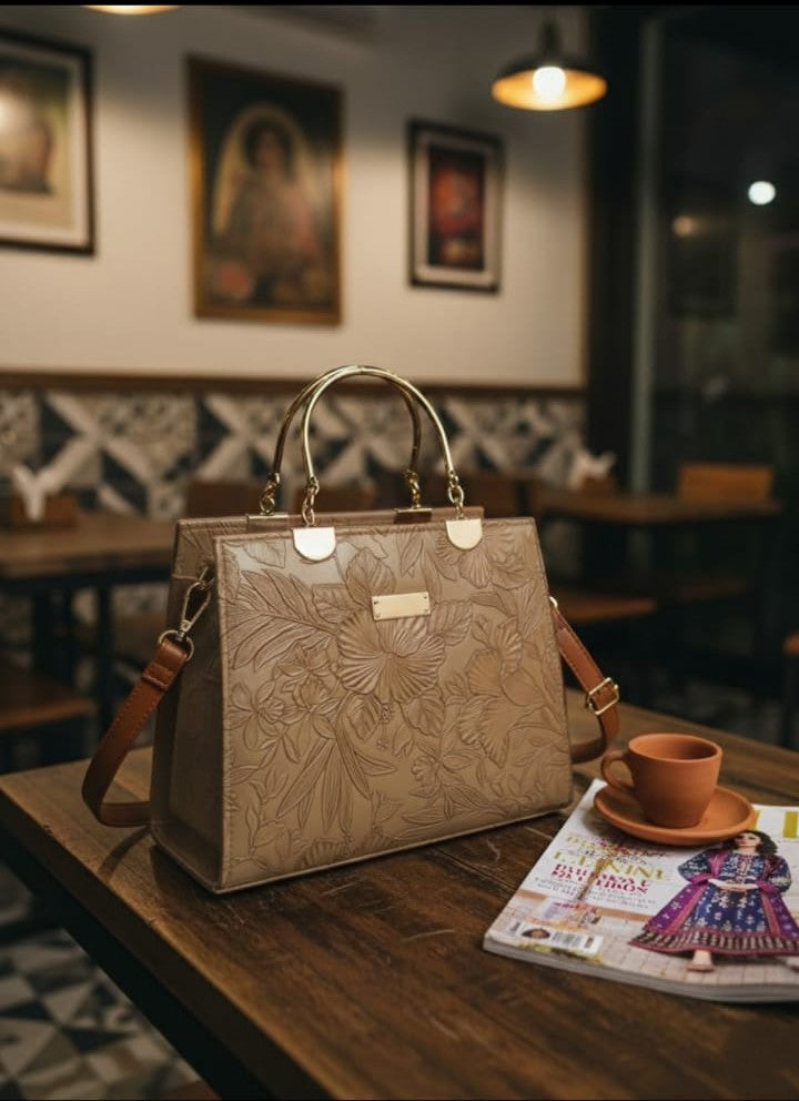 Ashir Studio floral embossed luxury tote collection jewelry display with intricate floral patterns on a high-quality tote.