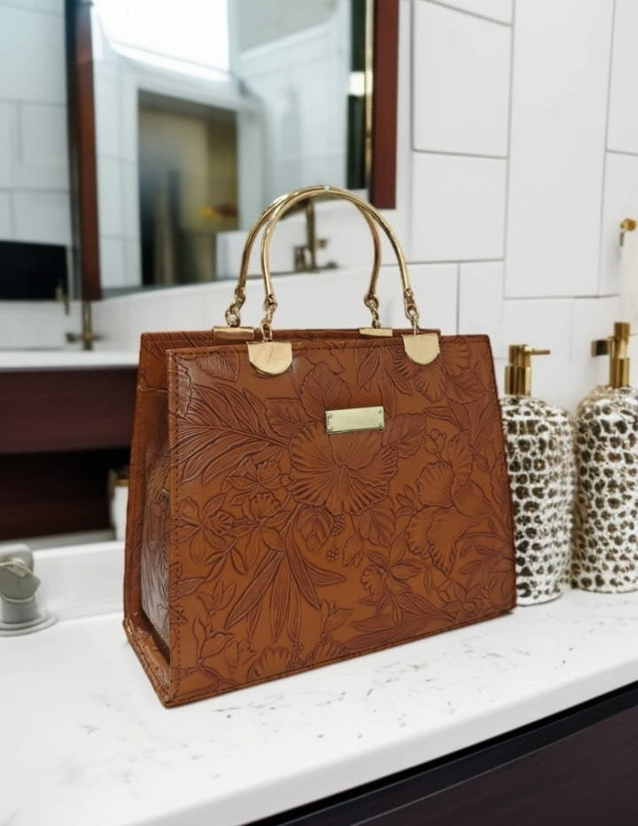 Ashir Studio floral embossed luxury tote jewelry collection with intricate design and elegant craftsmanship.
