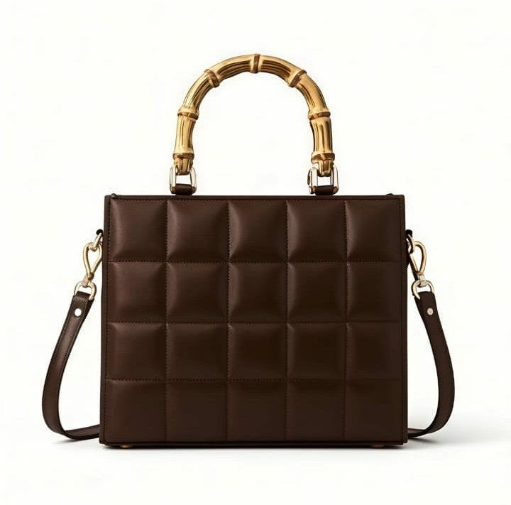 Elegant emerald quilted handbag with bamboo handle by Ashir Studio, showcasing a stylish and sophisticated accessory.