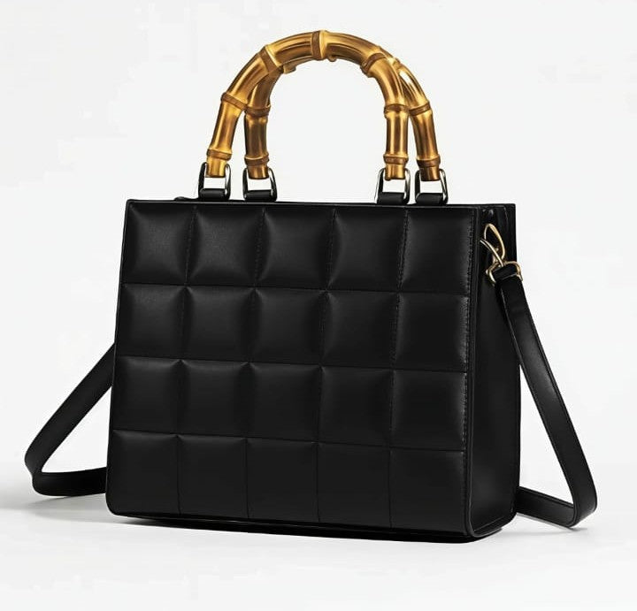 Emerald quilted handbag with bamboo handle, stylish and elegant, from Ashir Studio, featuring intricate stitching and natural bamboo accents.