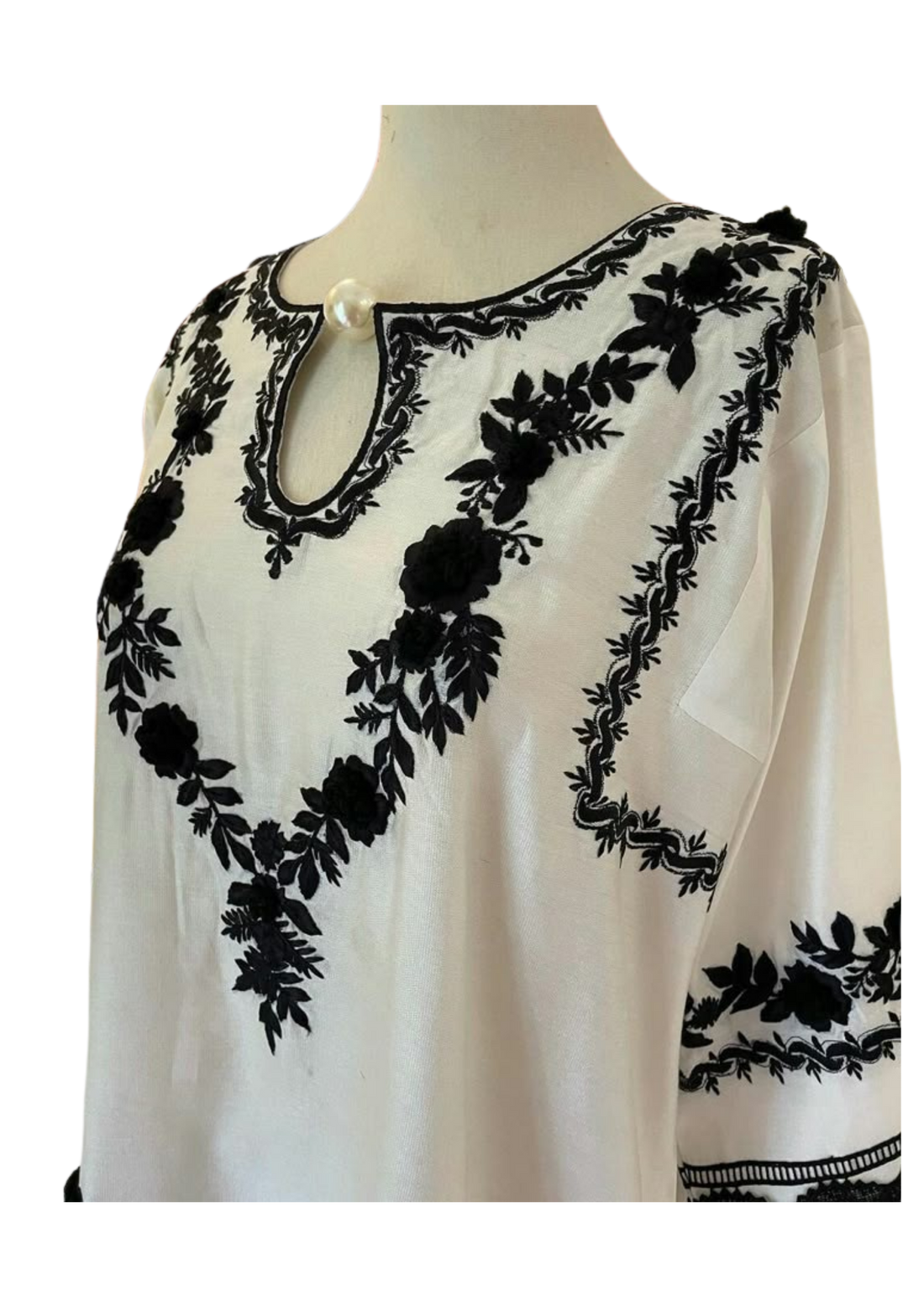Handmade white silk tunic by Ashir Studio with elegant drape, showcasing soft fabric and simple, stylish design.