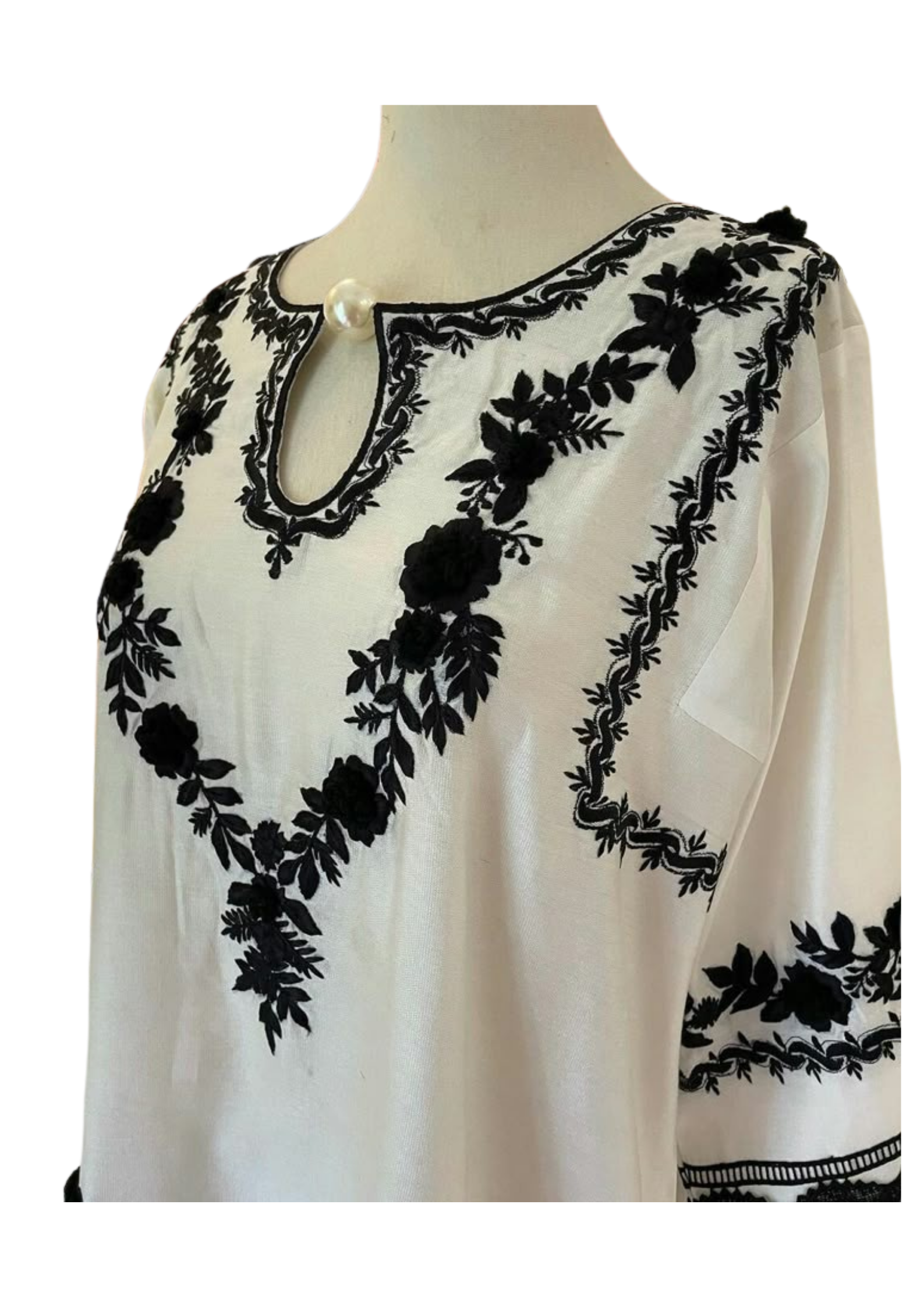 Handmade white silk tunic by Ashir Studio with elegant drape, showcasing soft fabric and simple, stylish design.