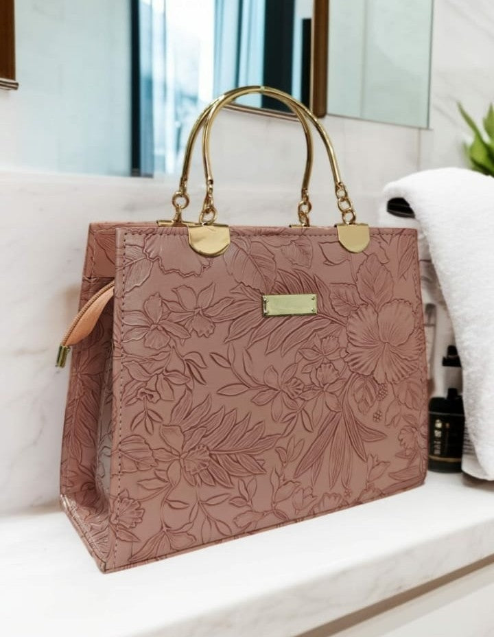 Ashir Studio floral embossed luxury tote collection jewelry, showcasing intricate floral patterns on a stylish jewelry case.