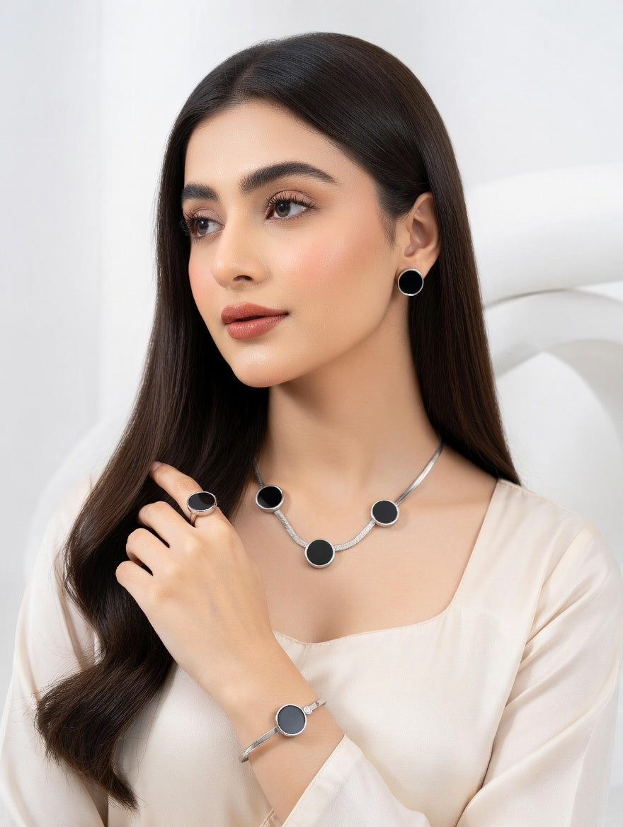 Black Onyx disc jewelry from Ashir Studio featuring a sleek, polished black gemstone pendant on a delicate chain.
