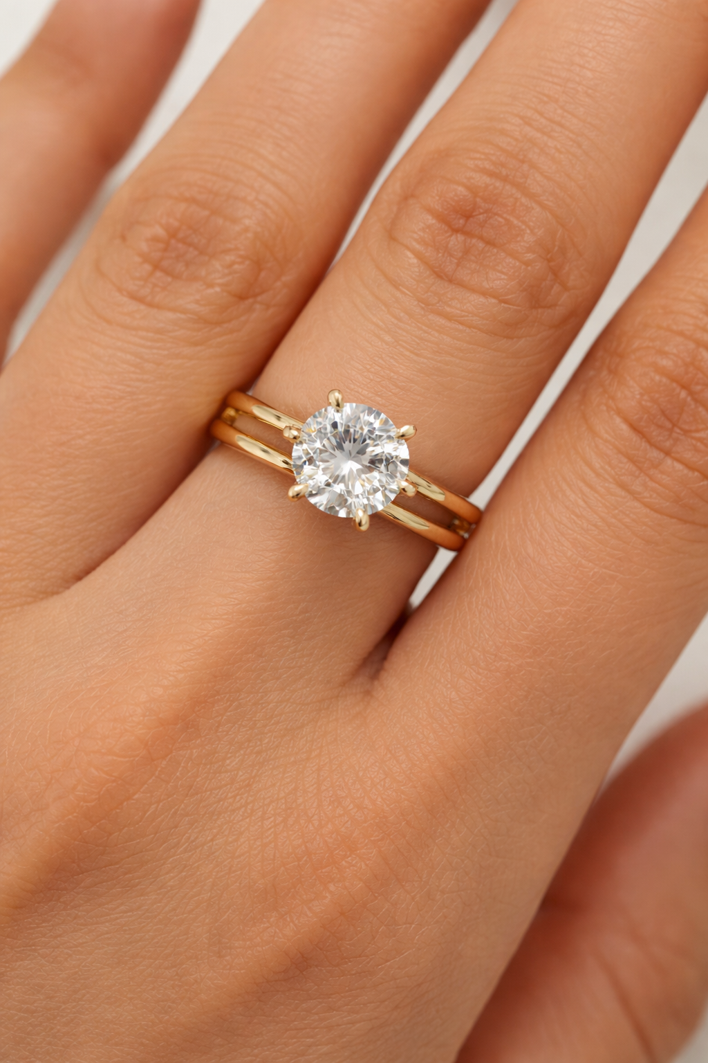 Elegant solitaire split-band ring by Ashir Studio featuring a sparkling gemstone set in a stylish jewelry design.