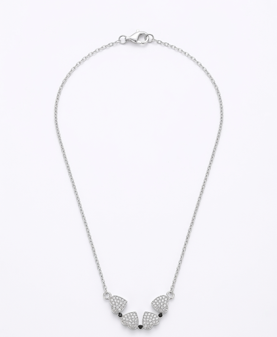 Ashir Studio magnetic four-leaf clover heart necklace with a delicate pendant, showcasing a charming jewelry piece.
