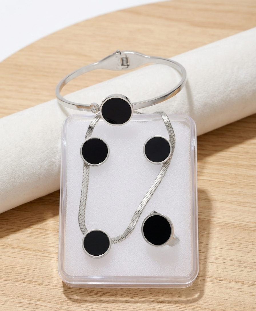 Black Onyx disc jewelry by Ashir Studio featuring a sleek, polished black gemstone pendant on a delicate chain.