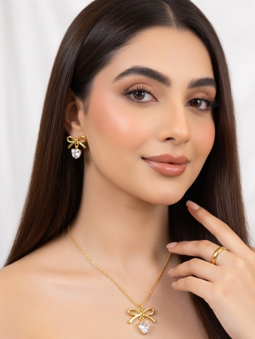 Elegant gold bow jewelry set by Ashir Studio featuring delicate bow-shaped accessories for a stylish look.