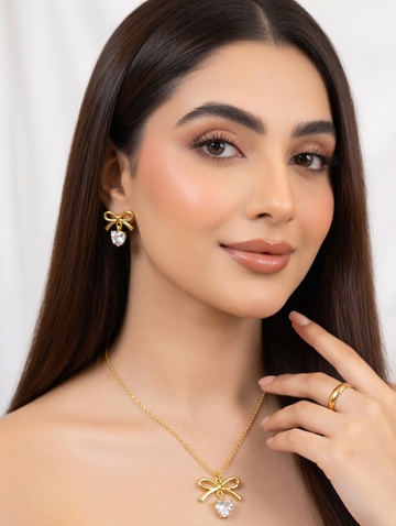 Elegant gold bow jewelry set by Ashir Studio featuring delicate bow-shaped accessories for a stylish look.