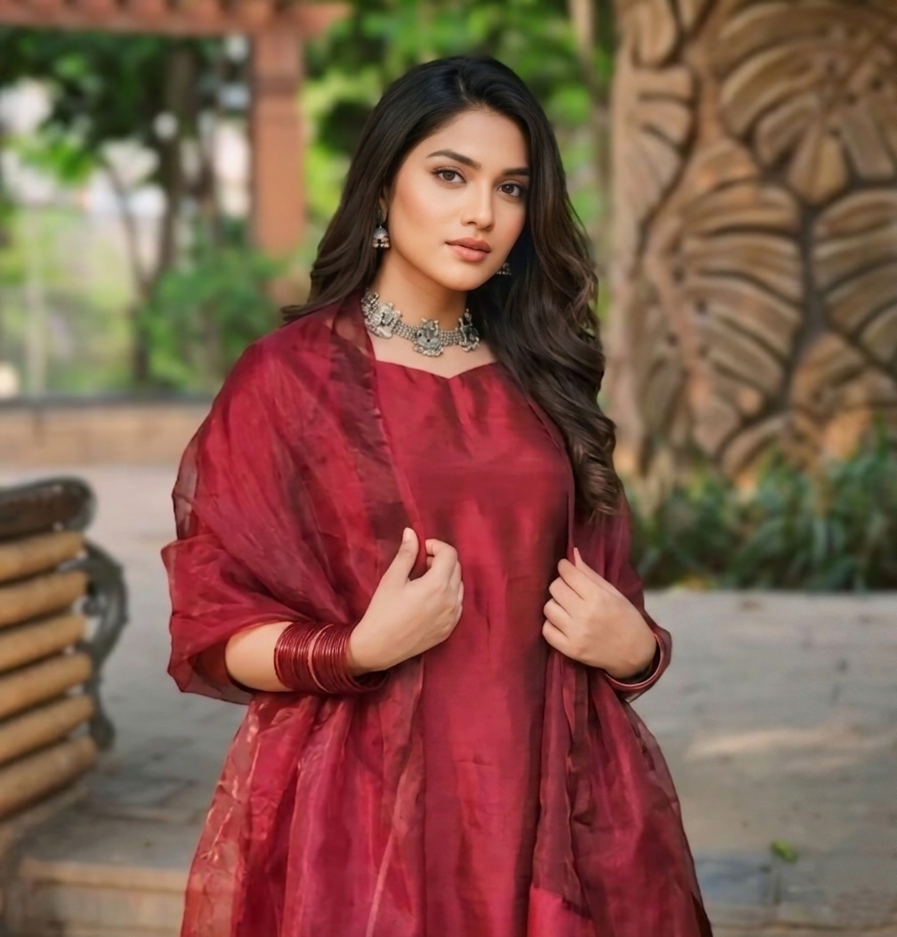 Elegant Farshi Shalwar Kameez by Ashir Studio featuring intricate embroidery and flowing fabric in vibrant colors.