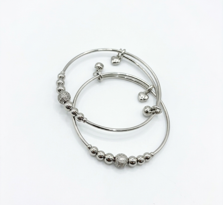 Elegant silver steel bracelet from Ashir Studio featuring a sleek, modern jewelry design with intricate detailing.