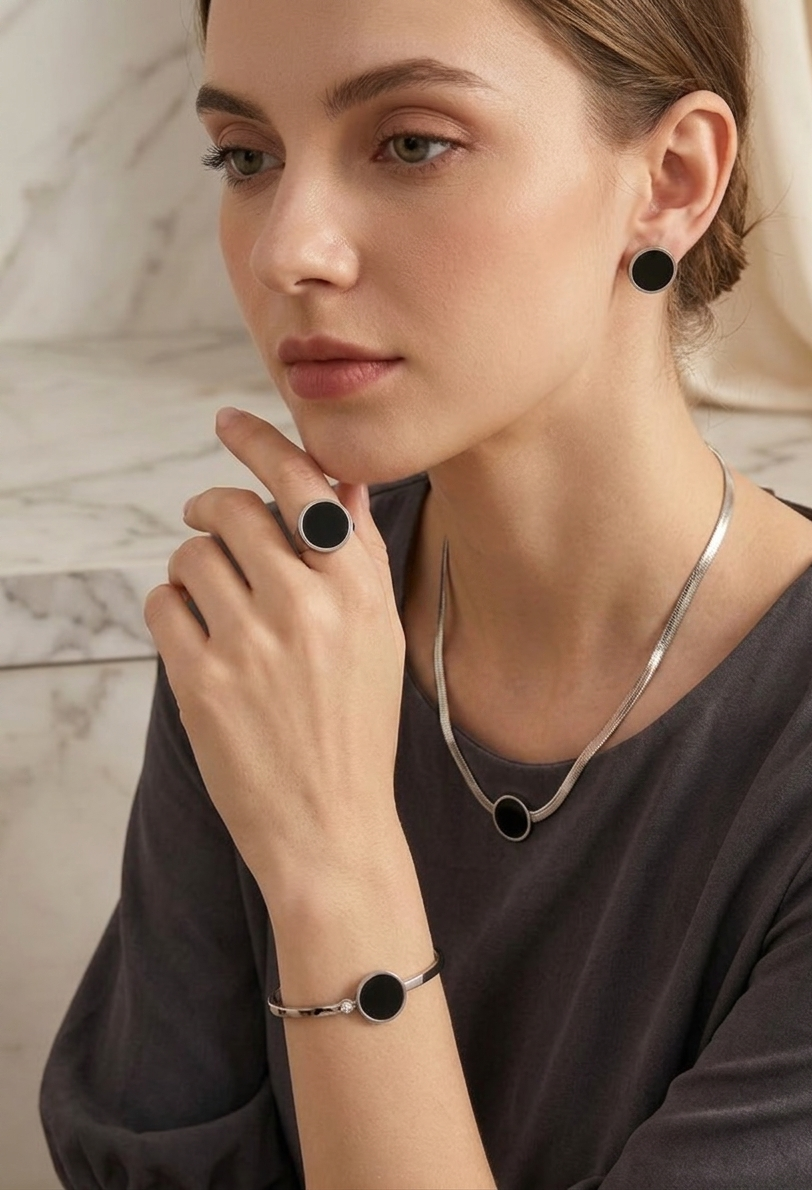 Black Onyx disc jewelry by Ashir Studio featuring a sleek, polished black gemstone pendant on a delicate chain.