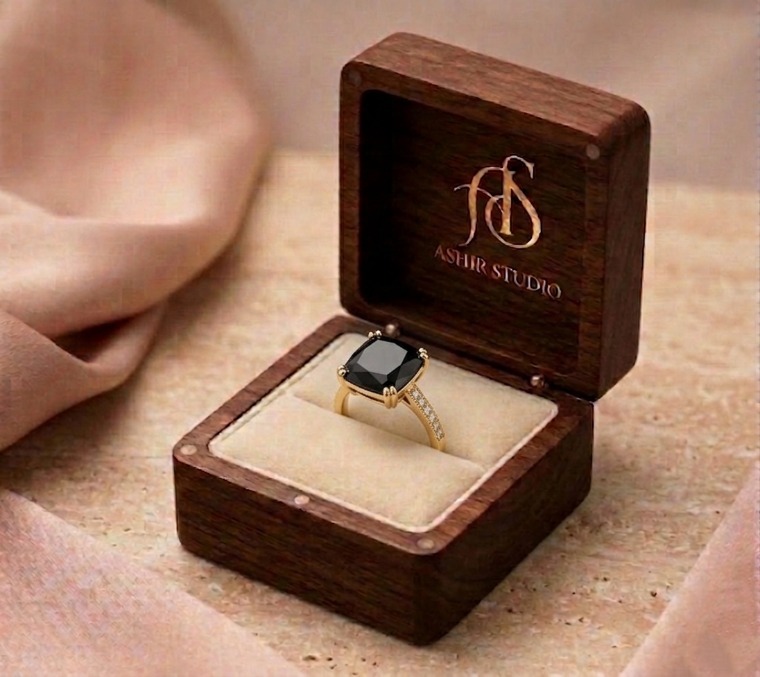 Emerald-cut black diamond halo ring in 18K yellow gold, showcasing elegant jewelry design by Ashir Studio.