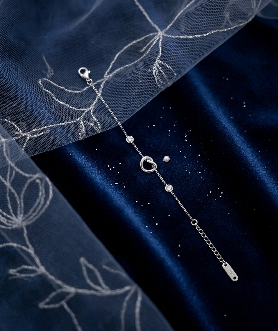 Silver-toned interlock bracelet from Ashir Studio, showcasing delicate jewelry design with interconnected links.
