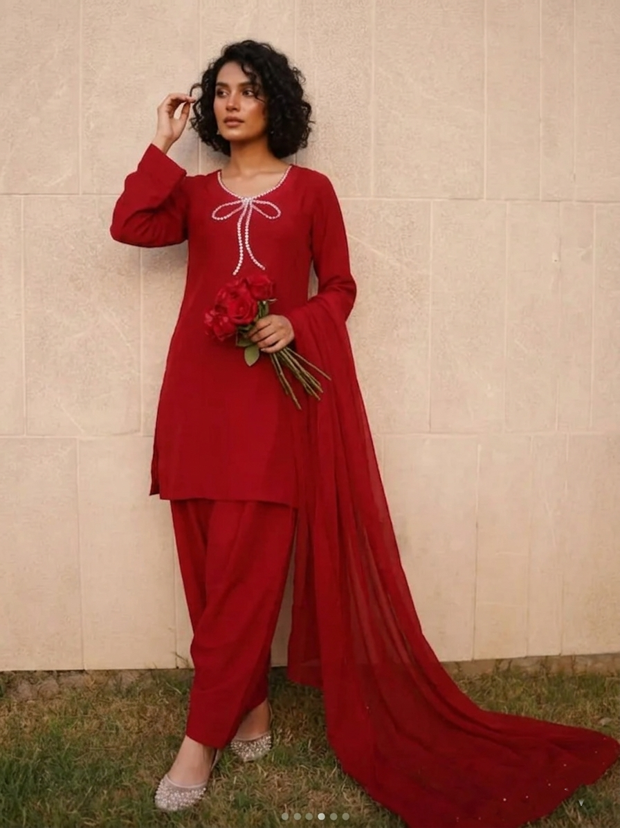 Elegant Farshi Shalwar Kameez by Ashir Studio featuring intricate embroidery and flowing fabric in vibrant colors.