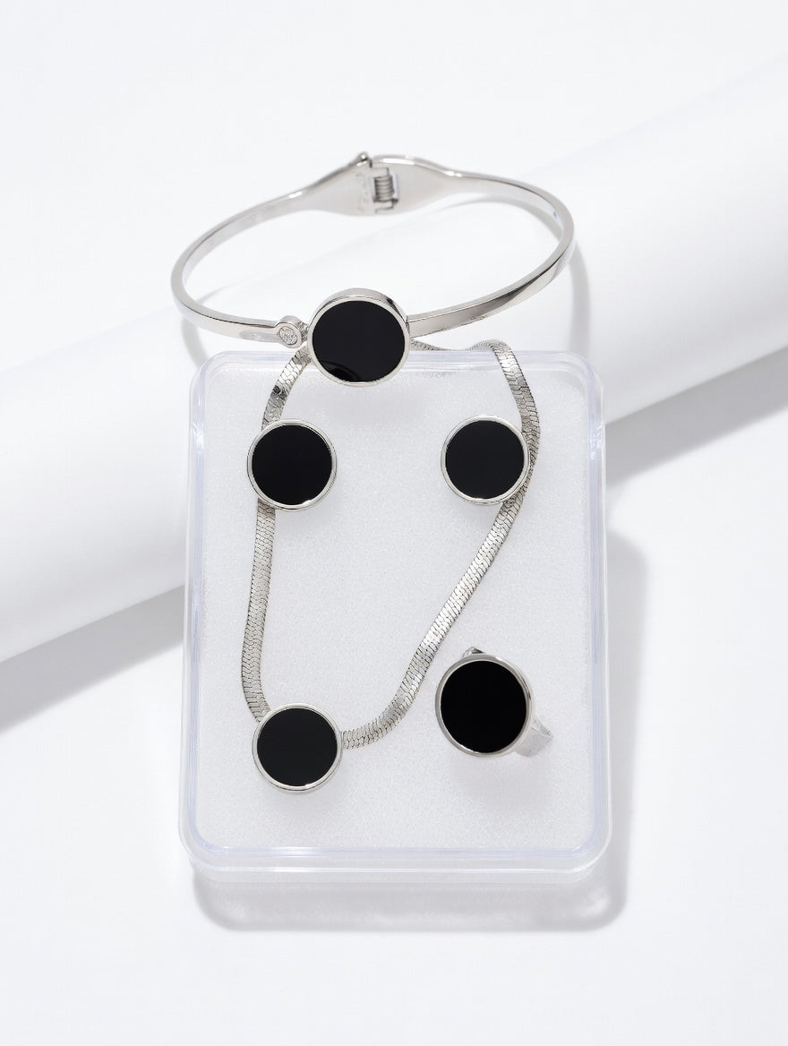 Black Onyx disc jewelry by Ashir Studio, featuring a sleek black stone pendant on a delicate chain.