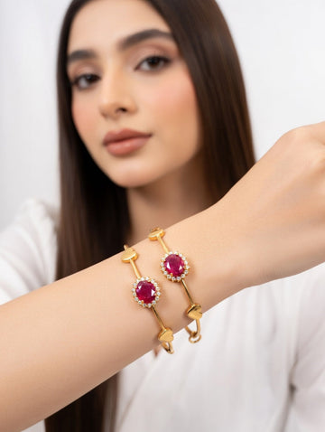 Elegant red Rubi gold bangles from Ashir Studio jewelry set, featuring intricate design and vibrant red gemstones.