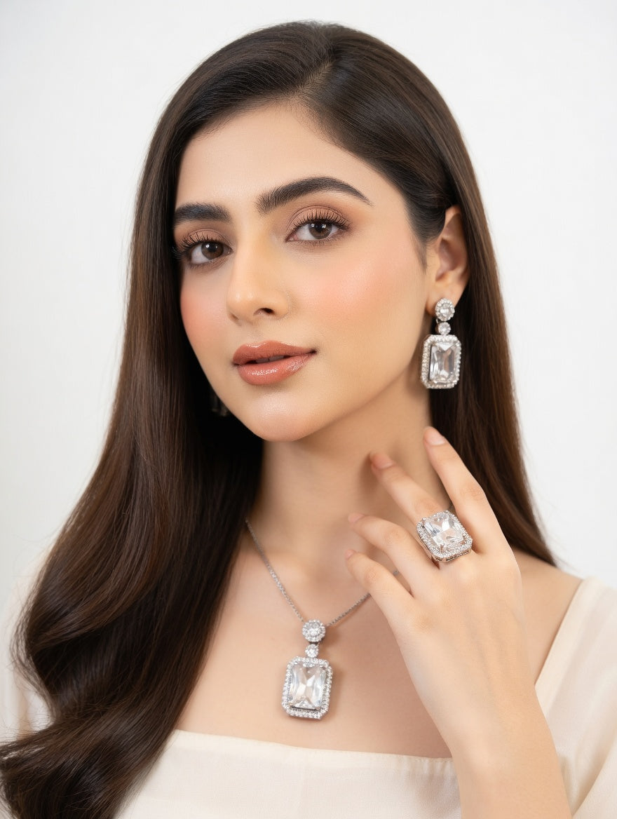 Elegant Ashir Studio Rubi jewellery set featuring intricate design and vibrant red rubi stones on a delicate gold-tone backdrop.