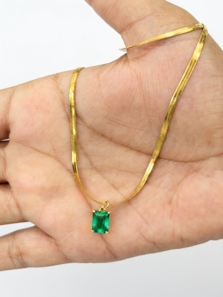Green emerald necklace featuring a delicate jewellery design by Ashir Studio with a vibrant emerald gemstone centerpiece.