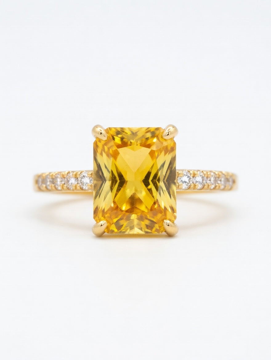 Ashir Studio emerald-cut citrine ring with sparkling accents, showcasing a vibrant yellow gemstone set in elegant jewelry design.