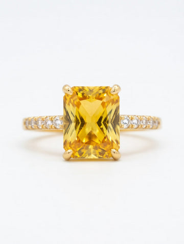 Ashir Studio emerald-cut citrine ring with sparkling accents, showcasing a vibrant yellow gemstone set in elegant jewelry design.