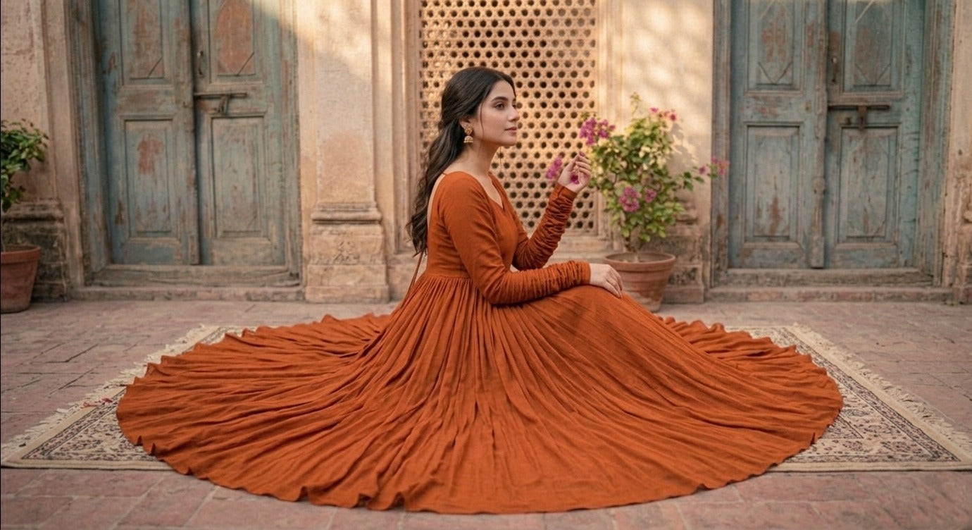 Brightly colored Royal Anarkali flare from Ashir Studio featuring intricate embroidery and flowing fabric, perfect for festive occasions.