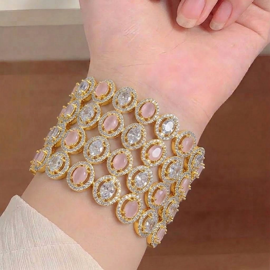 Elegant American diamond bangles from Ashir Studio featuring sparkling designs and intricate detailing on gold-tone metal.