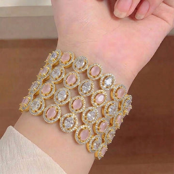 Elegant American diamond bangles from Ashir Studio featuring sparkling designs and intricate detailing on gold-tone metal.
