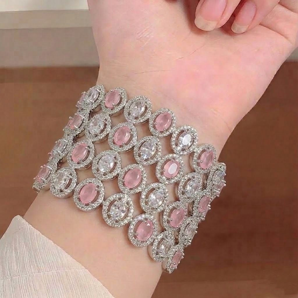 Golden American Diamond bangles from Ashir Studio featuring intricate design and sparkling stones, perfect for traditional wear.