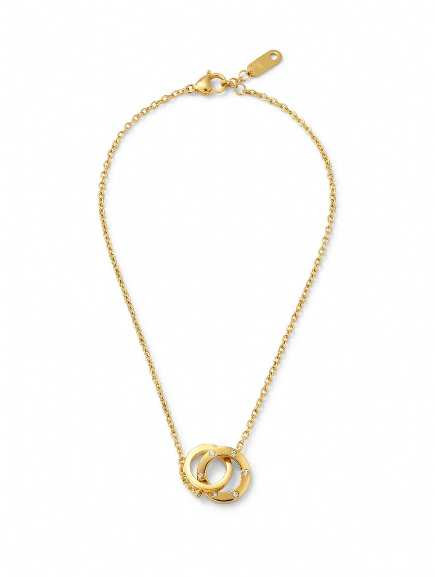 Interlocking double circle crystal necklace by Ashir Studio featuring sparkling crystal accents and a delicate silver chain.