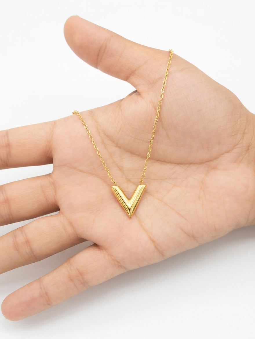 Ashir Studio V-shaped jewelry necklace with elegant design, featuring a sleek V pendant on a delicate chain.