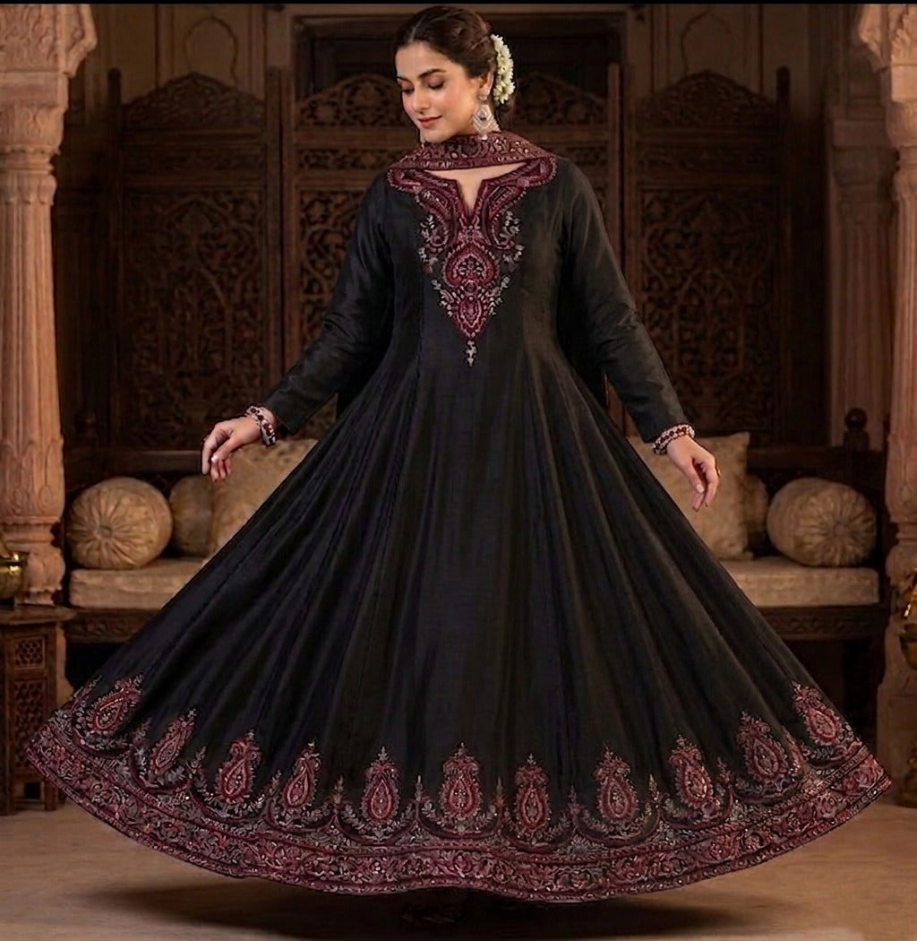 Maroon and gold embroidered black Anarkali gown by Ashir Studio with intricate patterns and elegant flowing fabric.