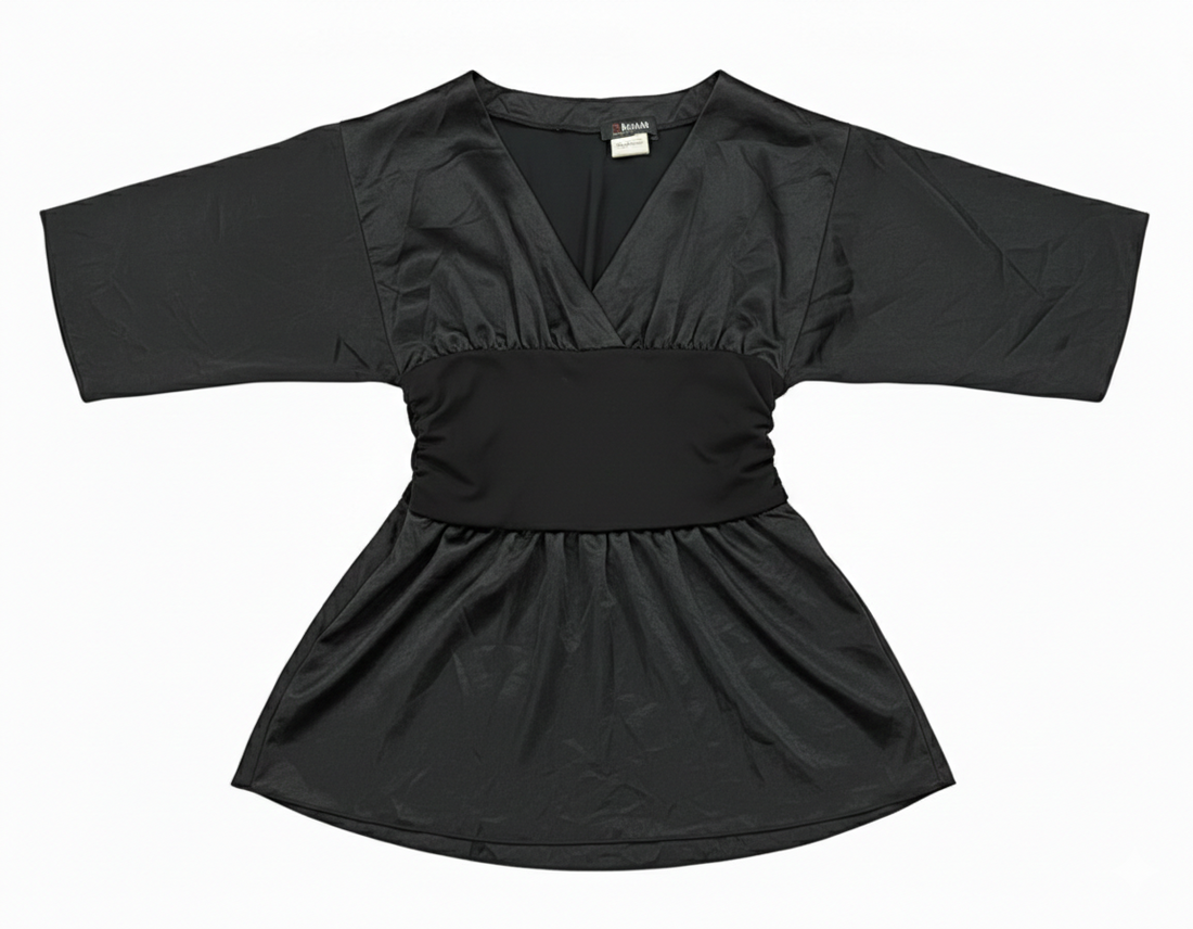 Model wearing Ashir Studio Midnight Onyx Tunic, a stylish black cloth with intricate details, showcased on a person.