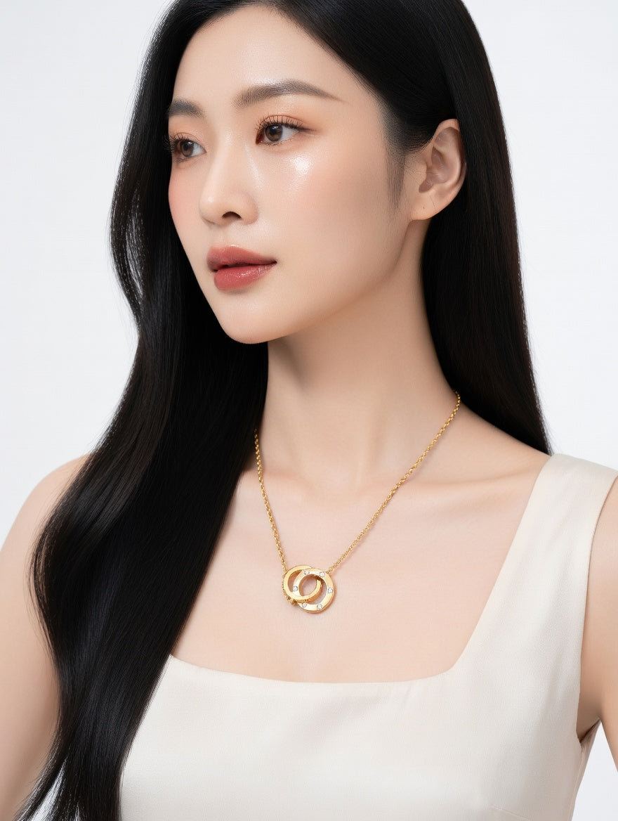 Ashir Studio interlocking double circle crystal necklace featuring sparkling crystal accents and a delicate chain.