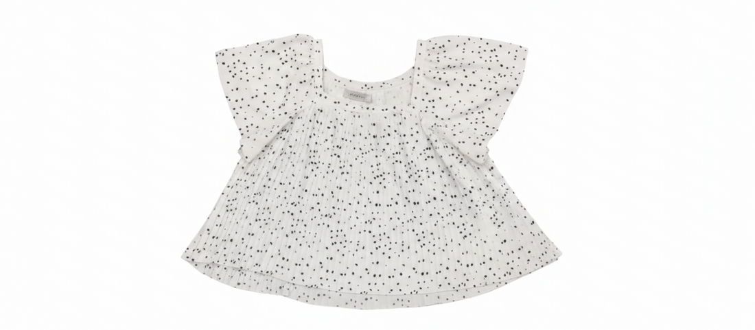 Katrina wearing Ashir Studio Cloud Speckle Puff-Sleeve Top with a relaxed fit and soft fabric, showcasing its stylish puff sleeves.