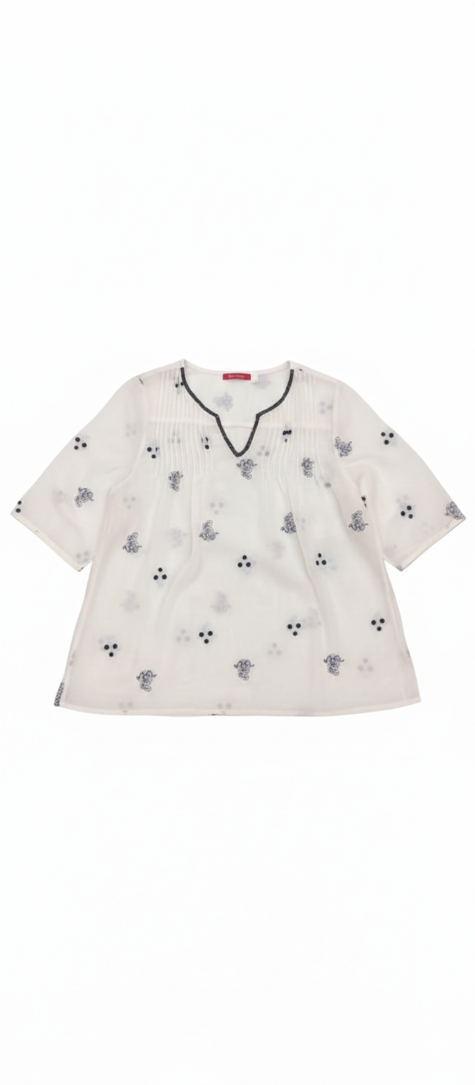 Ashir Studio Starry Night Pintuck Blouse shown in a close-up image with pintuck detailing and a relaxed, stylish fit.