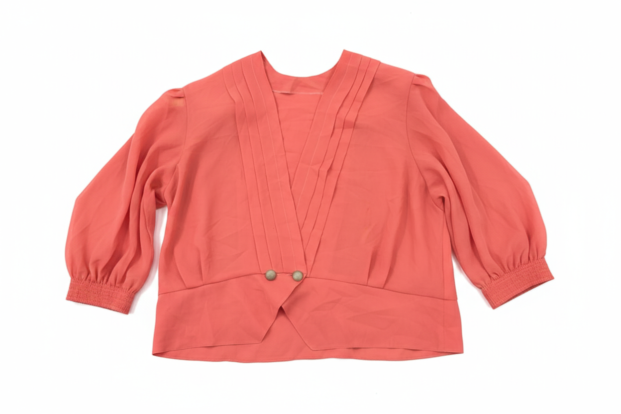 Ashir Studio crossover blouse in soft fabric, shown in a stylish design with draped details and vibrant color.